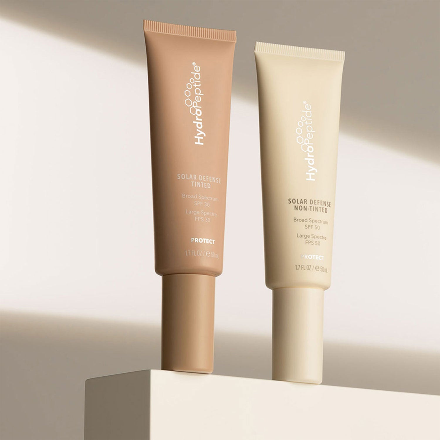 Angeled View - HydroPeptide® Solar Defense Non-Tinted SPF 50 and HydroPeptide® Solar Defense Tinted SPF 30
